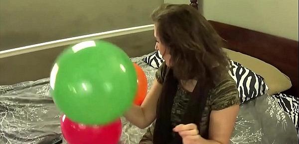  Blowing Balloons and Popping Them While Chewing Bubblegum